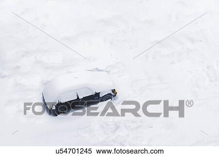 Stock Photography - Car trapped in deep snow.. Fotosearch