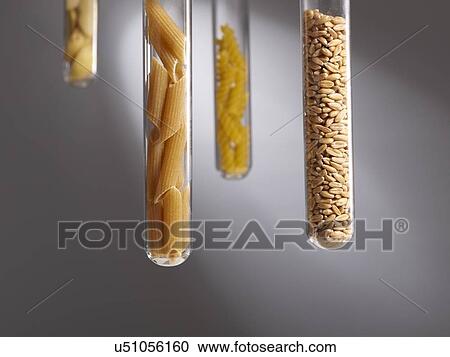 Stock Image - Carbohydrate foods in test tubes, studio shot.. Fotosearch