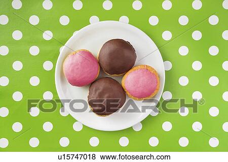 Stock Photo - Chocolate and strawberry donuts.. Fotosearch