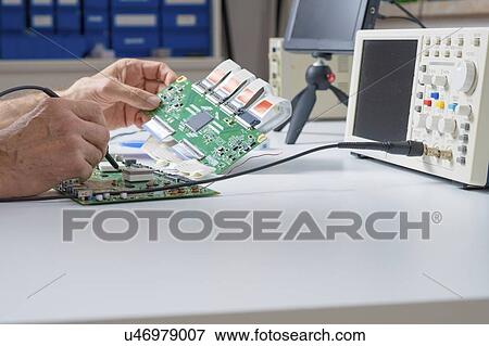 Stock Photo - Circuit board repair.. Fotosearch