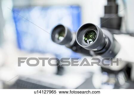 Stock Photography - Close-up of a light microscope in a laboratory.. Fotosearch