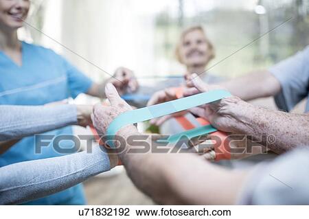 Close up of senior adults using resistance bands in exercise class. View Large Photo Image Stock Image - Close up of senior adults using resistance bands in exercise class.. Fotosearch