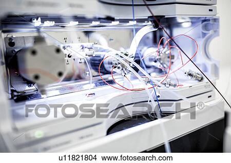 Picture - Close-up of temperature-controlled column compartment used to heat or cool samples for liquid chromatography. Liquid chromatography is used to separate compounds from a mixture of compounds dissolved in a liquid.. Fotosearch