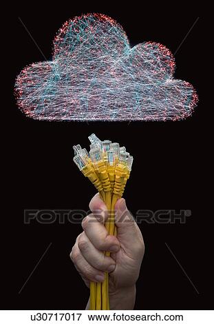 Stock Photo - Cloud computing, conceptual composite image. Person connecting RJ45 cables into a cloud.. Fotosearch