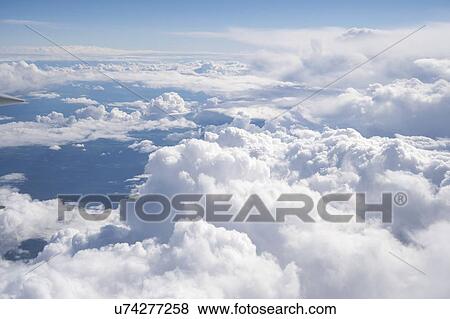 Stock Photo - Clouds from aeroplane window.. Fotosearch