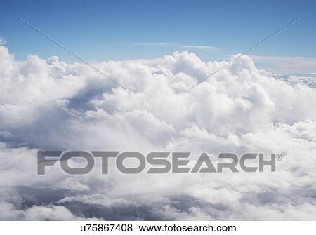 Stock Photo - Clouds from aeroplane window.. Fotosearch