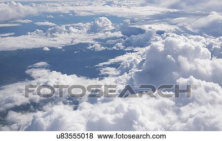 Stock Photo - Clouds from aeroplane window.. Fotosearch