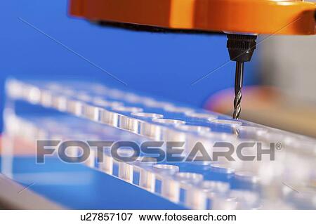 Stock Photo - CNC milling machine drilling plastic block#.. Fotosearch