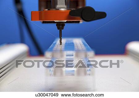 Stock Photo - CNC milling machine drilling plastic block#.. Fotosearch