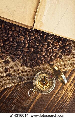 Picture - Coffee beans and compass.. Fotosearch