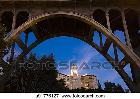 Stock Photo - Colorado Bridge Arch frames U. S. Ninth Circuit Court of Appeals at dusk, Pasadena, CA. Fotosearch