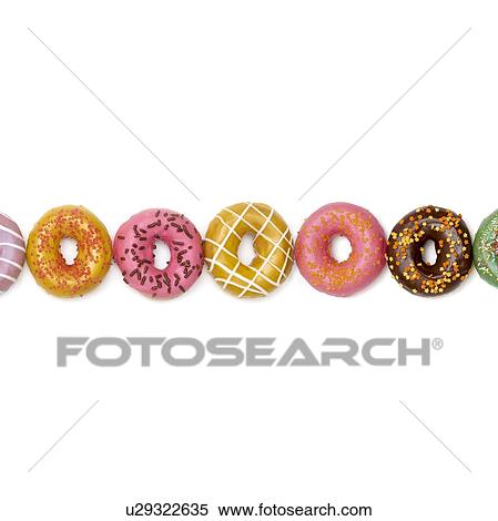 Colourful doughnuts in a row, studio shot. View Large Photo Image Stock Photography - Colourful doughnuts in a row, studio shot.. Fotosearch