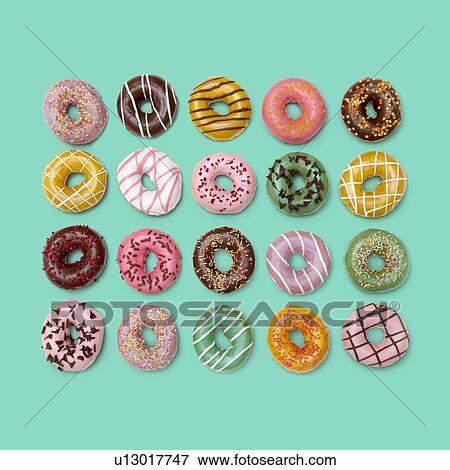 Stock Photo - Colourful doughnuts, studio shot.. Fotosearch
