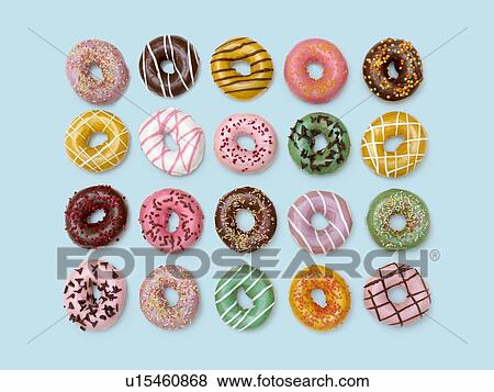 Stock Photo - Colourful doughnuts, studio shot.. Fotosearch
