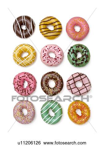 Stock Photograph - Colourful doughnuts, studio shot.. Fotosearch