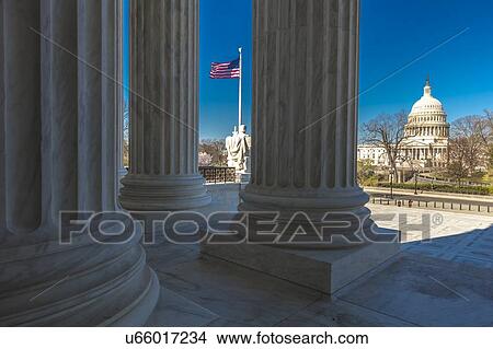 Picture - Columns of Supreme Court offers view of US Capitol. Fotosearch