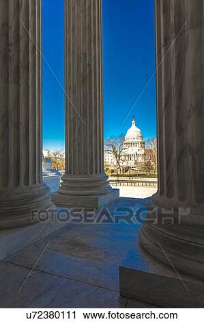 Columns of Supreme Court offers view of US Capitol View Large Photo Image Stock Image - Columns of Supreme Court offers view of US Capitol. Fotosearch