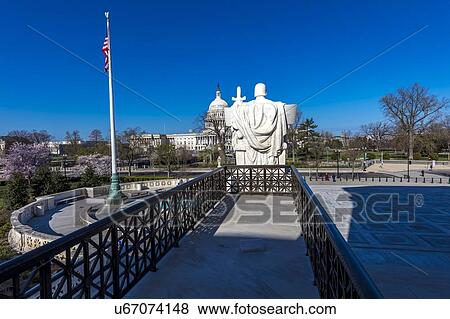 Columns of Supreme Court offers view of US Capitol View Large Photo Image Stock Photo - Columns of Supreme Court offers view of US Capitol. Fotosearch