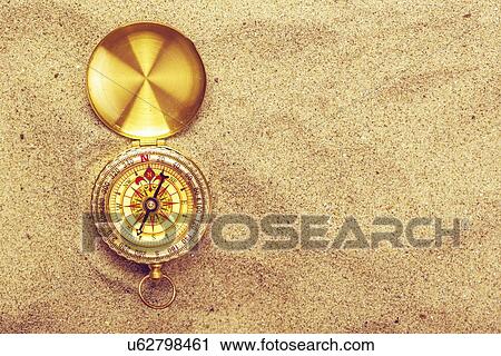Compass in sand. View Large Photo Image Stock Image - Compass in sand.. Fotosearch