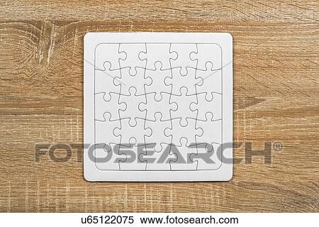 Stock Photography - Completed blank jigsaw puzzle.. Fotosearch