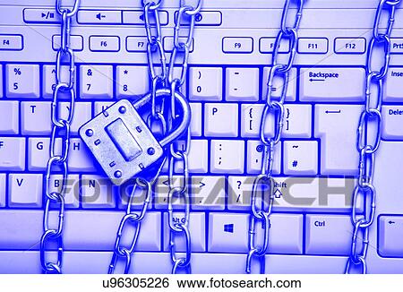 Computer keyboard with metal chains and padlock. View Large Photo Image Stock Photograph - Computer keyboard with metal chains and padlock.. Fotosearch