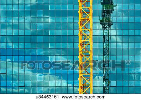 Construction crane and skyscraper. View Large Photo Image Stock Image - Construction crane and skyscraper.. Fotosearch