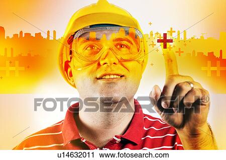 Stock Image - Construction engineer with touch screen, conceptual image.. Fotosearch