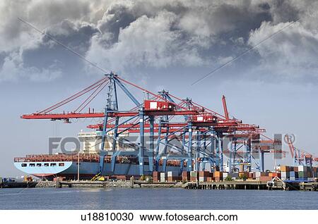 Container ship being loaded with cargo by large container-cranes. View Large Photo Image Stock Image - Container ship being loaded with cargo by large container-cranes.. Fotosearch