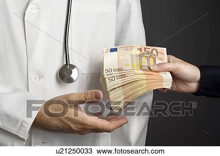 Stock Image - Corruption in healthcare industry, conceptual image.. Fotosearch