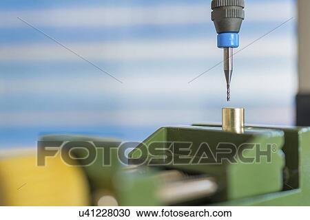 Stock Image - Cutting tool on CNC (computer numerical control) milling machine.. Fotosearch