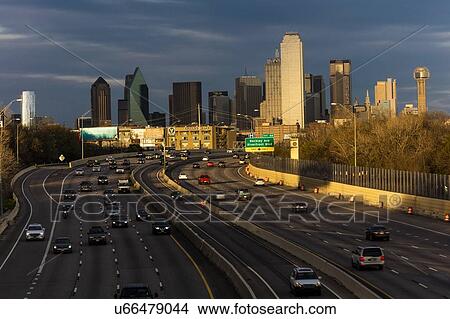 Picture - Dallas skyline and Tom Landry Freeway, Interstate 30 at night. Fotosearch