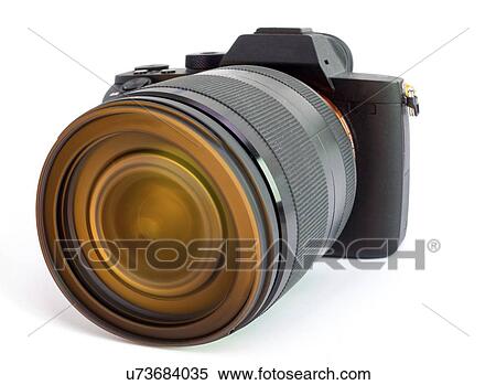 Stock Photography - Digital mirrorless camera with zoom lens.. Fotosearch