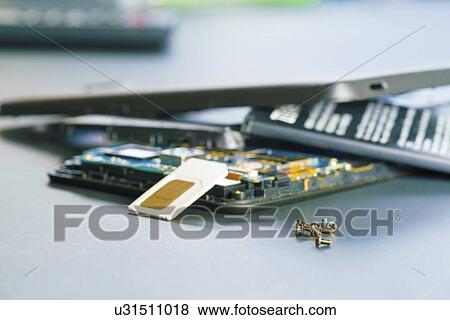 Disassembled mobile phone in the service centre with internal components of the camera and speaker. View Large Photo Image Stock Photo - Disassembled mobile phone in the service centre with internal components of the camera and speaker.. Fotosearch