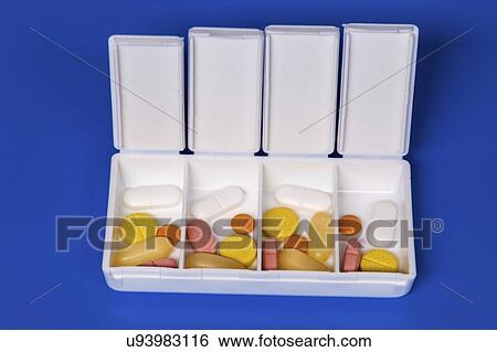Dispenser with tablets. View Large Photo Image Stock Photograph - Dispenser with tablets.. Fotosearch