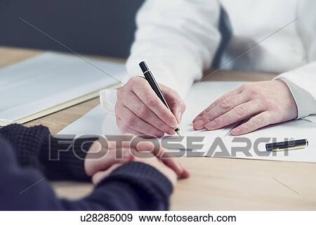 Doctor taking notes. View Large Photo Image Stock Photo - Doctor taking notes.. Fotosearch