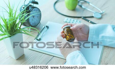 Stock Photograph - Doctor with pills.. Fotosearch