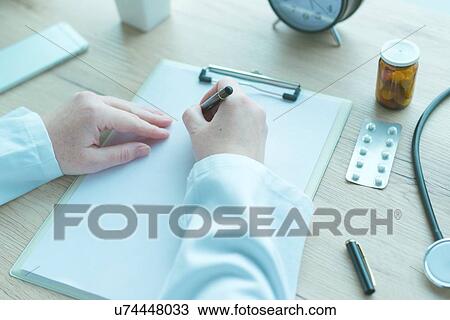 Doctor writing notes. View Large Photo Image Stock Image - Doctor writing notes.. Fotosearch