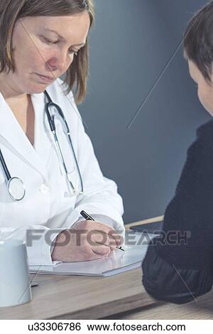 Doctor writing prescription. View Large Photo Image Stock Photograph - Doctor writing prescription.. Fotosearch
