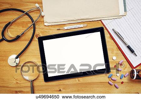 Stock Image - Doctor's desk, conceptual image.. Fotosearch
