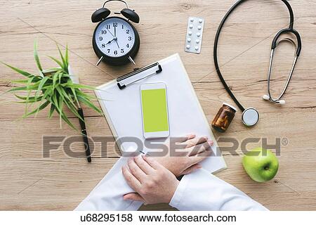 Stock Photo - Doctor's desk, conceptual image.. Fotosearch