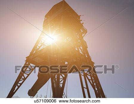 Drilling rig in the sun. View Large Photo Image Stock Photograph - Drilling rig in the sun.. Fotosearch