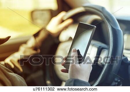 Driver using smartphone. View Large Photo Image Stock Image - Driver using smartphone.. Fotosearch