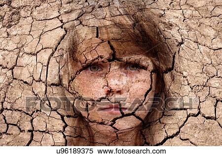 Dry cracked earth with girl's face, conceptual image. View Large Photo Image Stock Photography - Dry cracked earth with girl's face, conceptual image.. Fotosearch