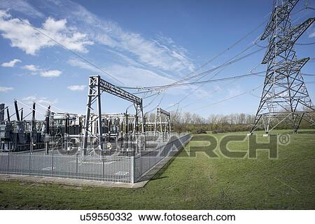 Stock Image - Electricity generating substation and connection to high voltage power lines.. Fotosearch