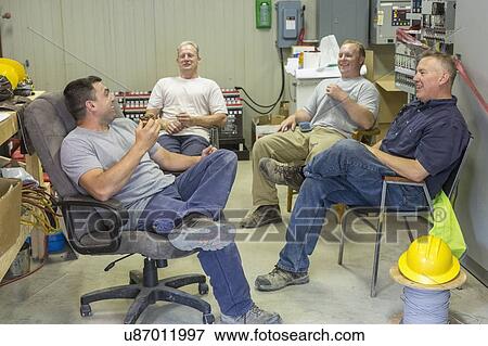 Stock Photo - Engineers sitting in an electric power plant.. Fotosearch