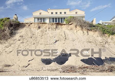 Eroding sand dunes caused by the removal of vegetation, Sedgefield, Western Cape, South Africa. View Large Photo Image Stock Image - Eroding sand dunes caused by the removal of vegetation, Sedgefield, Western Cape, South Africa.. Fotosearch