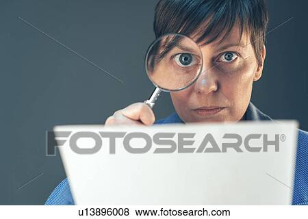 Examining small print, conceptual image. View Large Photo Image Stock Photo - Examining small print, conceptual image.. Fotosearch