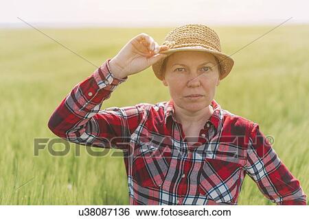 Stock Photograph - Farmer in wheat field.. Fotosearch