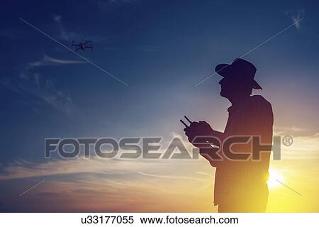 Farmer piloting drone. View Large Photo Image Stock Photography - Farmer piloting drone.. Fotosearch