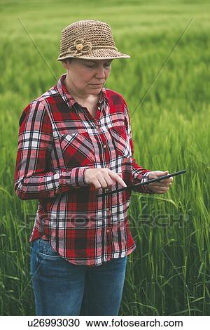 Farmer using digital tablet. View Large Photo Image Stock Image - Farmer using digital tablet.. Fotosearch